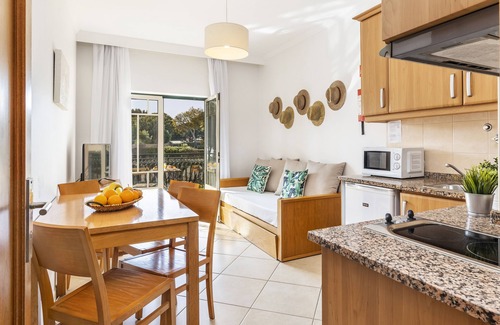 Santa Eulalia Apartment | Elegant One Bedroom Apt Steps from the Beach with Pools