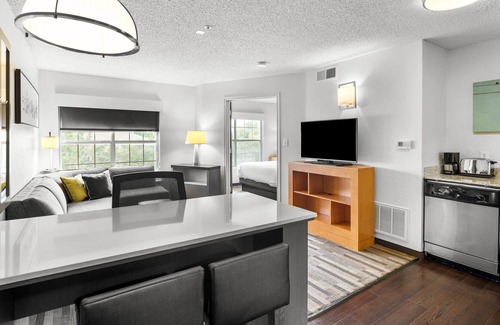 Gateway Apartment | One Bedroom King Suite - Domain Area with a Pool