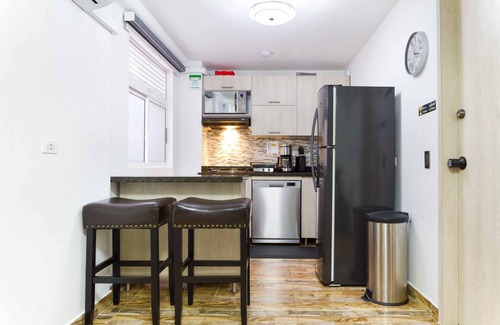 Medellin Apartment | Perfect Retreat: One Bedroom with Balcony & Hot Tub