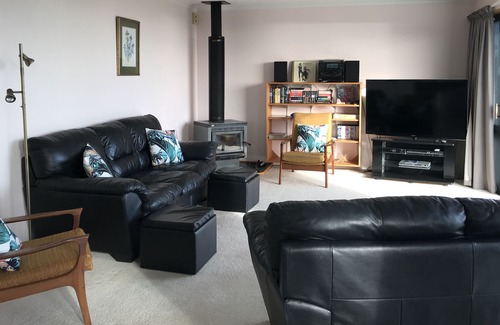 Pohara House | Only steps from the beach. Roomy, relaxed family fun. Good old Kiwi bach.