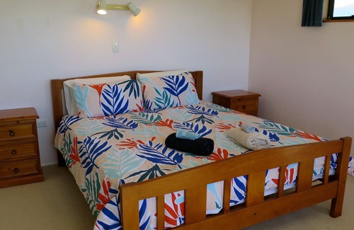 Pohara House | Only steps from the beach. Roomy, relaxed family fun. Good old Kiwi bach.