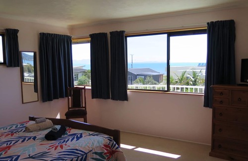 Pohara House | Only steps from the beach. Roomy, relaxed family fun. Good old Kiwi bach.