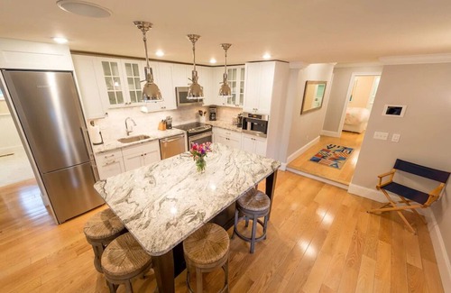 Yachting Village Condo | Inviting Open Concept Getaway with Fireplace Near Mansions