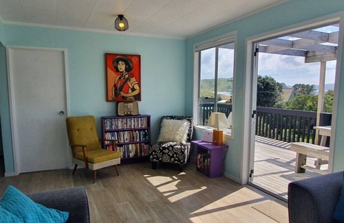 Opito Bay House | Opito Bay Charmer - Sun drenched family bach is a real charmer.