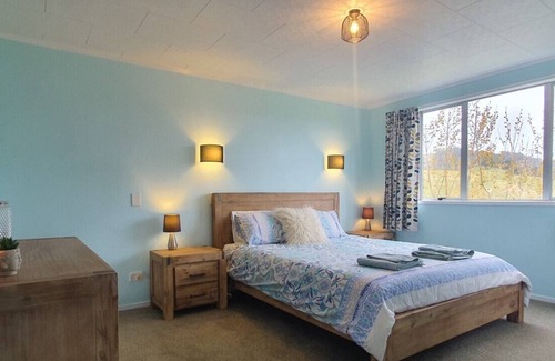 Opito Bay House | Opito Bay Charmer - Sun drenched family bach is a real charmer.