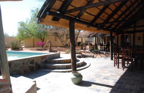 Kamanjab Cabin | Inviting Stay at Oppi-Koppi Rest Camp with Pool and Breakfast