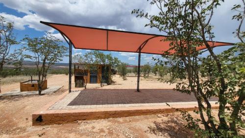 Opuwo Other | Opuwo Country Lodge Campsite: Poolside Retreat with Ocean View