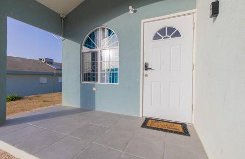 Discovery Bay House | Idyllic Osmax Oasis: Beachfront 2-Bedroom Retreat