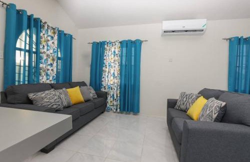 Discovery Bay House | Idyllic Osmax Oasis: Beachfront 2-Bedroom Retreat