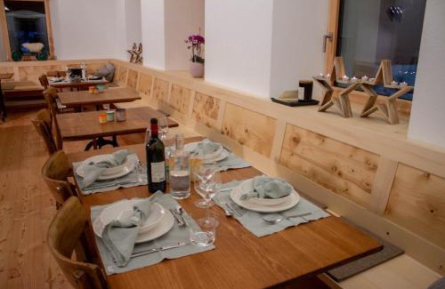 Bedretto Hotel | Discover Comfort at Osteria Bäkar - Pet Friendly & Accessible