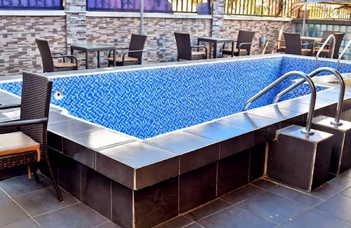 Lagos Apartment | Relax at Owee Suites: 4-Star Pool & Spa Experience