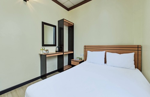Medan Hotel | Discover OYO 3493 Nami House: Family-Friendly Stays