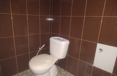 Palu Hotel | Budget-Friendly OYO 90699 Yellow White Guesthouse in Palu