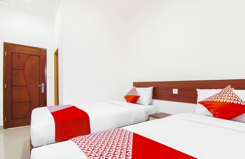 Dumai Hotel | Cozy OYO 91301 Lewis Dc Guesthouse with Breakfast Included