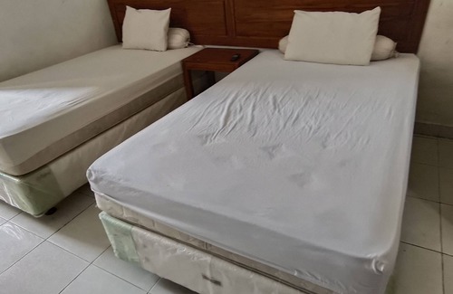 Banjarmasin Hotel | Budget-Friendly Stay at OYO 93123 Wisma Hamalau Syariah
