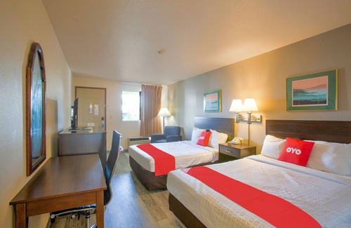 Woodland Hotel | Inviting OYO Woodland Hotel with Breakfast and Family Amenities