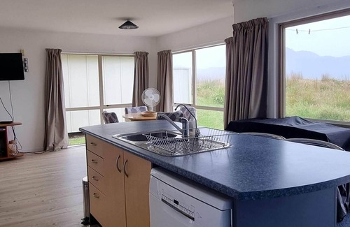 Kennedy Bay House | Beachfront Bliss at Pūkeko Retreat with Family Amenities