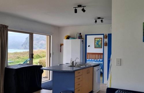 Kennedy Bay House | Beachfront Bliss at Pūkeko Retreat with Family Amenities