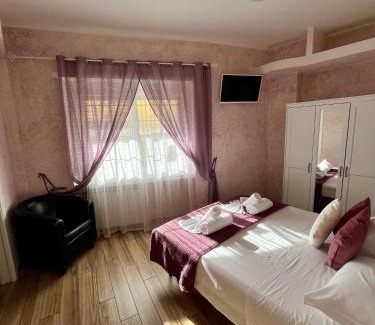 Fiumicino House | Discover Paganino Rooms: Family-Friendly with Kitchen Amenities