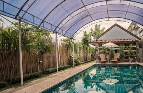 Thani Hotel | Relax at Pai Sukhothai Resort with Pool and Family Amenities