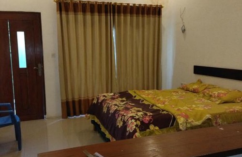 Kuta House | Pet-Friendly Pakok Homestay: Your Cozy Budget Retreat