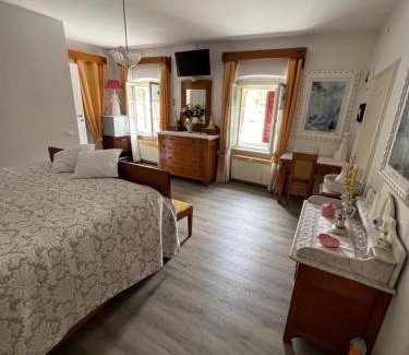 Santo Stefano di Cadore House | Experience Palazzo Cervesato: Room Regina Margherita Awaits