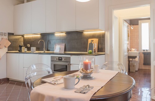 Codigoro Apartment | Palazzo Spada: Penthouse with River View & Top Amenities
