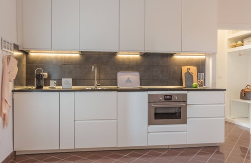 Codigoro Apartment | Palazzo Spada: Penthouse with River View & Top Amenities