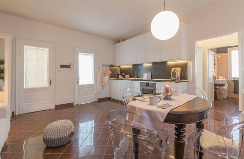 Codigoro Apartment | Palazzo Spada: Penthouse with River View & Top Amenities
