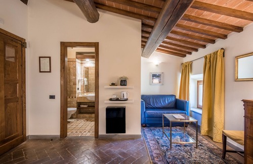 Castellina in Chianti Hotel | Discover Palazzo Squarcialupi: 4-Star Haven with Spa & Pool