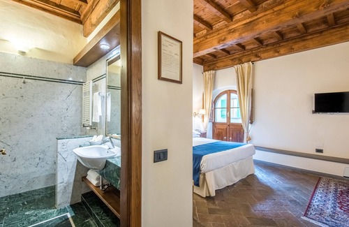Castellina in Chianti Hotel | Discover Palazzo Squarcialupi: 4-Star Haven with Spa & Pool