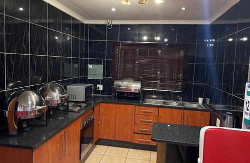 Rustenburg Bed & Breakfast | Cozy Pale Bohemia Bed and Breakfast with Family-Friendly Amenities