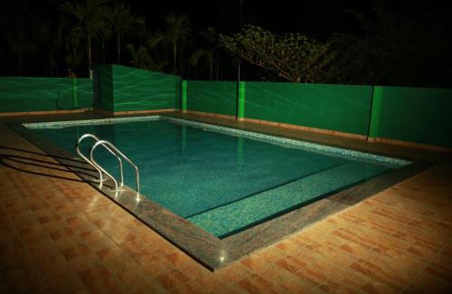 Kushalnagar Resort | Relax at Palm Era Resorts with Pool and Family-Friendly Perks