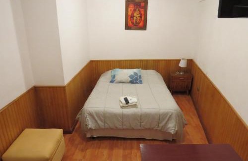 Cavancha House | Cozy Palm Hostal: Family-Friendly with Kitchen Amenities