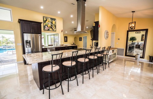 Apollo Beach House | Inviting Palm Tree III Pool Home with Ocean View & Spa