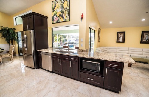 Apollo Beach House | Inviting Palm Tree III Pool Home with Ocean View & Spa