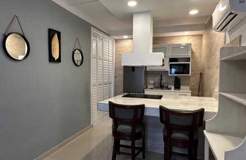 Humacao Pueblo Apartment | Elegant Palmas View Premium 7: Top-Rated Poolside Retreat