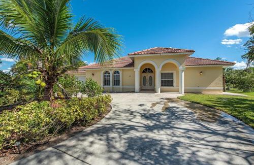 Palm River Estates Villa | Relaxing Palms and Pool Home Near Naples Best Beaches