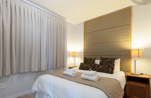 Lagoon Beach Apartment | Beachfront Retreat with Balcony and Pool Access