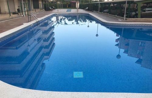 La Pineda Apartment | Paradise Awaits at Paradis Park: Poolside & Oceanfront Living