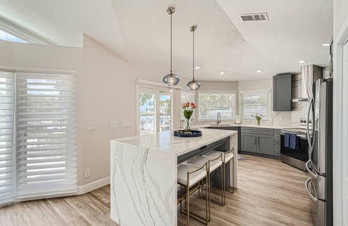 Harbor Hills House | Inviting Waterfront Retreat with Ocean Views Near Belleair Beach