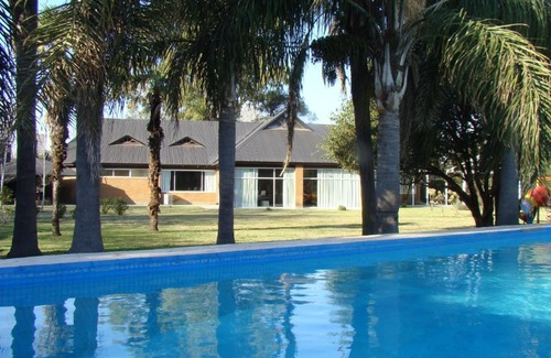 Funes Apartment | Discover Parador 15: Family-Friendly with Pool & Top Rated