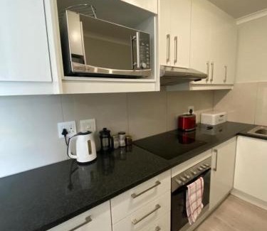 Observatory Apartment | Bright and Inviting: Paragon Domain with Pool Access