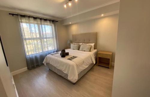 Observatory Apartment | Bright and Inviting: Paragon Domain with Pool Access
