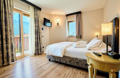 Riva del Garda Hotel | Elegant Parc Hotel Flora: Rated 9.4, Pool & Spa Awaits