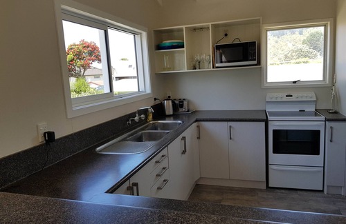 Whangamata House | Experience Patuwai: Oceanfront Stay with Pet-Friendly Perks