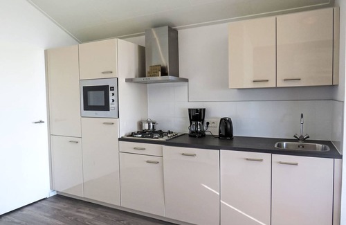 Bovenkarspel House | Relax at Pavilion 5 by Interhome with Spa and Lake Views