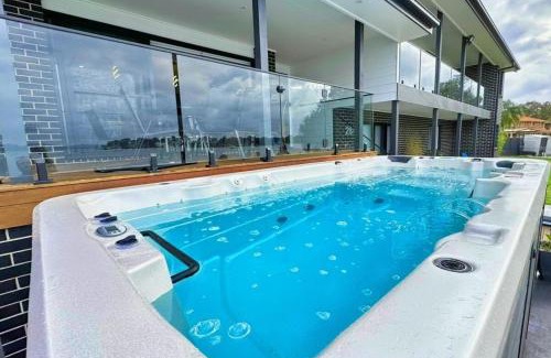 Tanilba Bay House | Serene Retreat in Paradise: Spa, Pool & Waterviews
