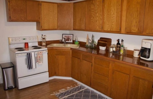 Tomah Apartment | Tranquil 2-Bed Retreat with Office & Hot Tub for Families