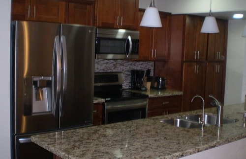 Sunland Village House | Tranquil Townhouse Retreat with Heated Pool and Ocean Views